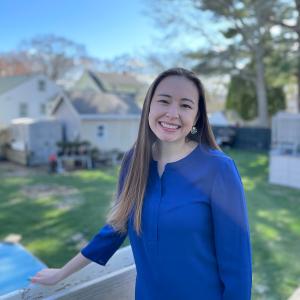Stephanie Wong posing outside a backyard