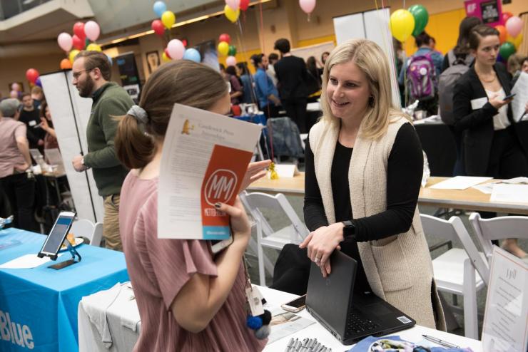A student and employer at the career fair