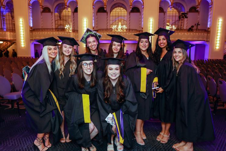 Group of students posing in cap and gowns