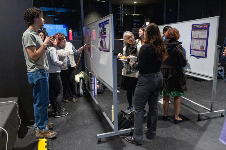 Faculty, staff, and students mingle and learn about each others' projects during the Celebration of Research, held March 31 at the Judee. Photo/Derek Palmer