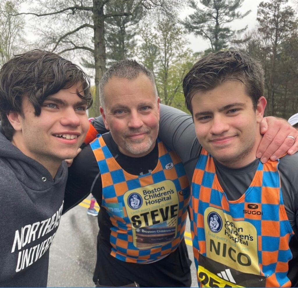 Two sons with their father after running