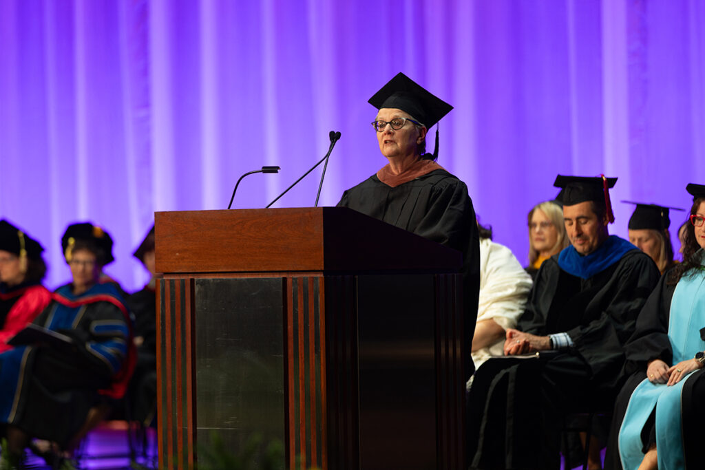 Jan Roberts-Breslin speaks at the podium