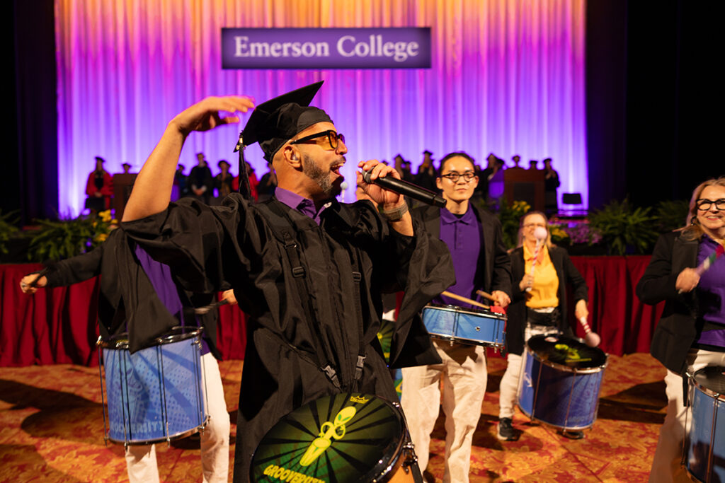 a congo drummer cheers before the ceremony