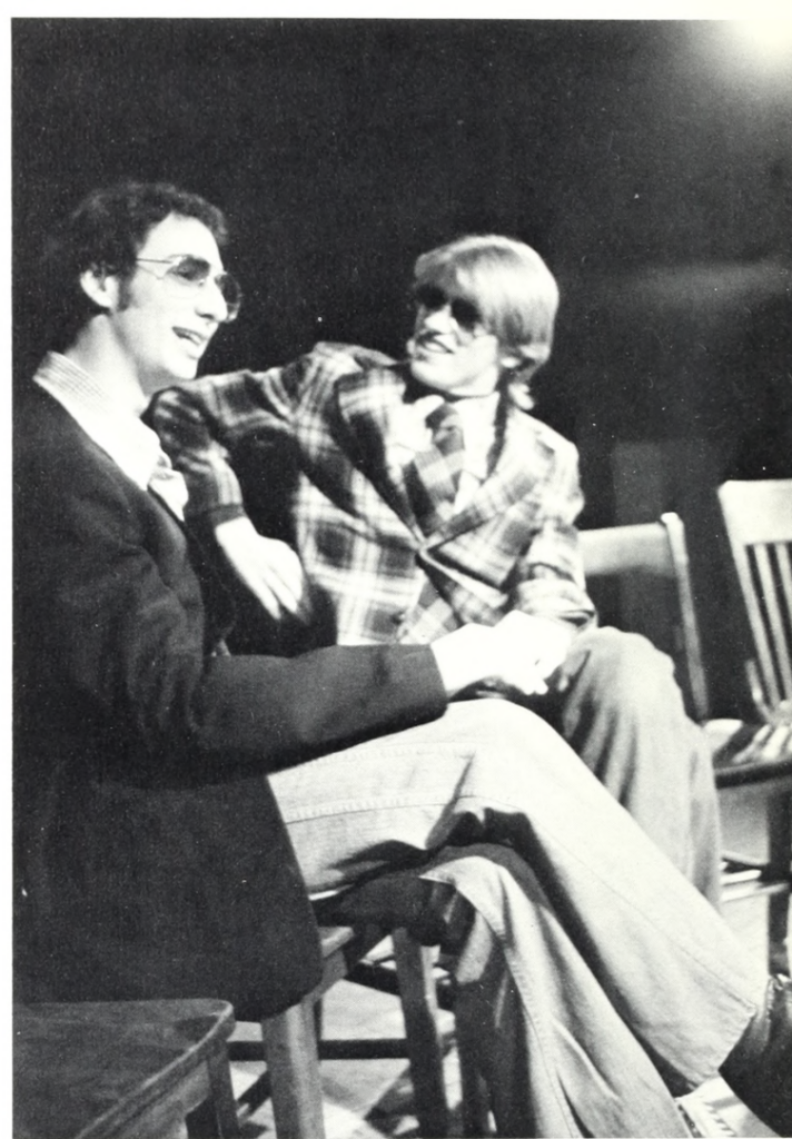 Two people perform on stage